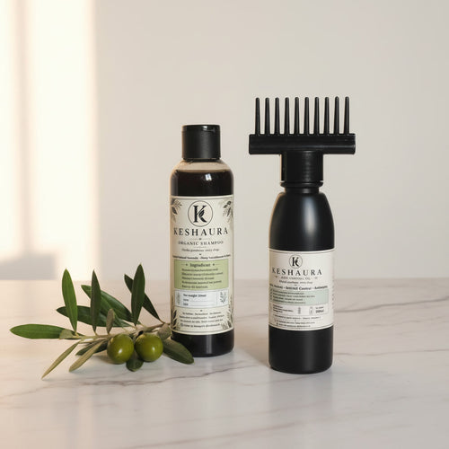Keshaura Complete Herbal Hair Care Bundle — anti hairfall oil and herbal shampoo handcrafted in Karachi, black bottles on marble surface